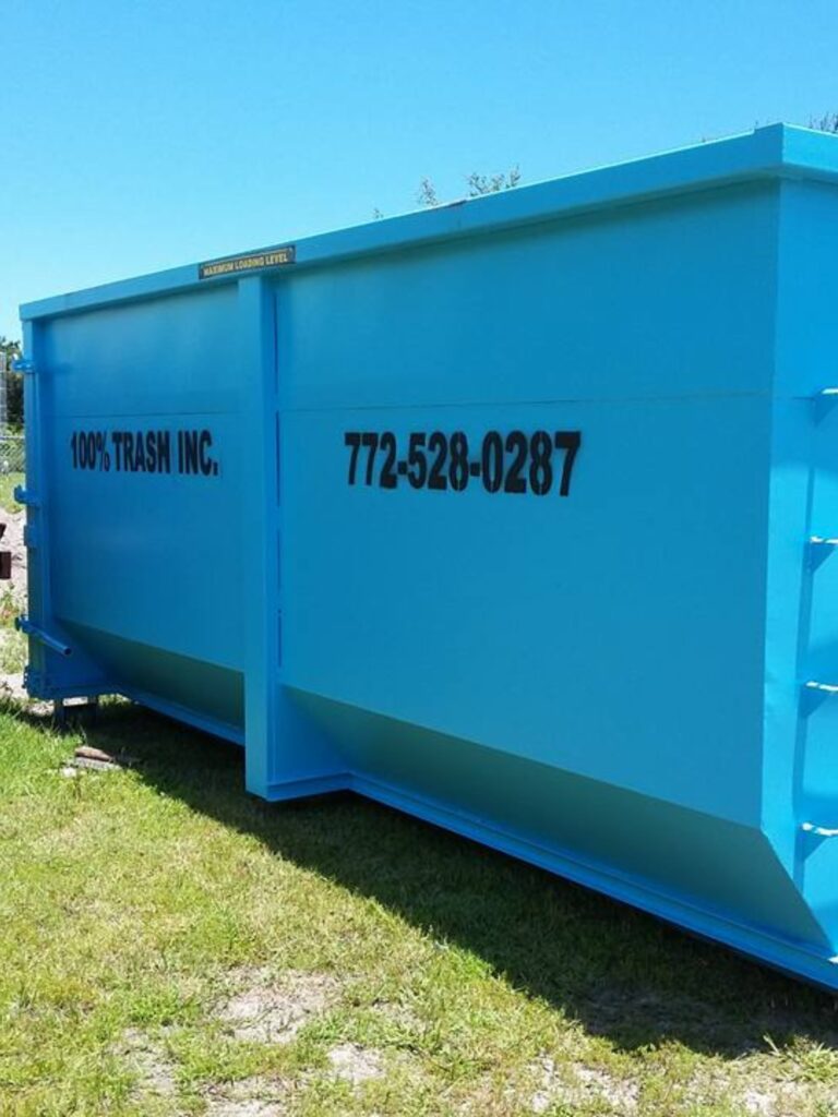 Blue dumpster with company contact information.