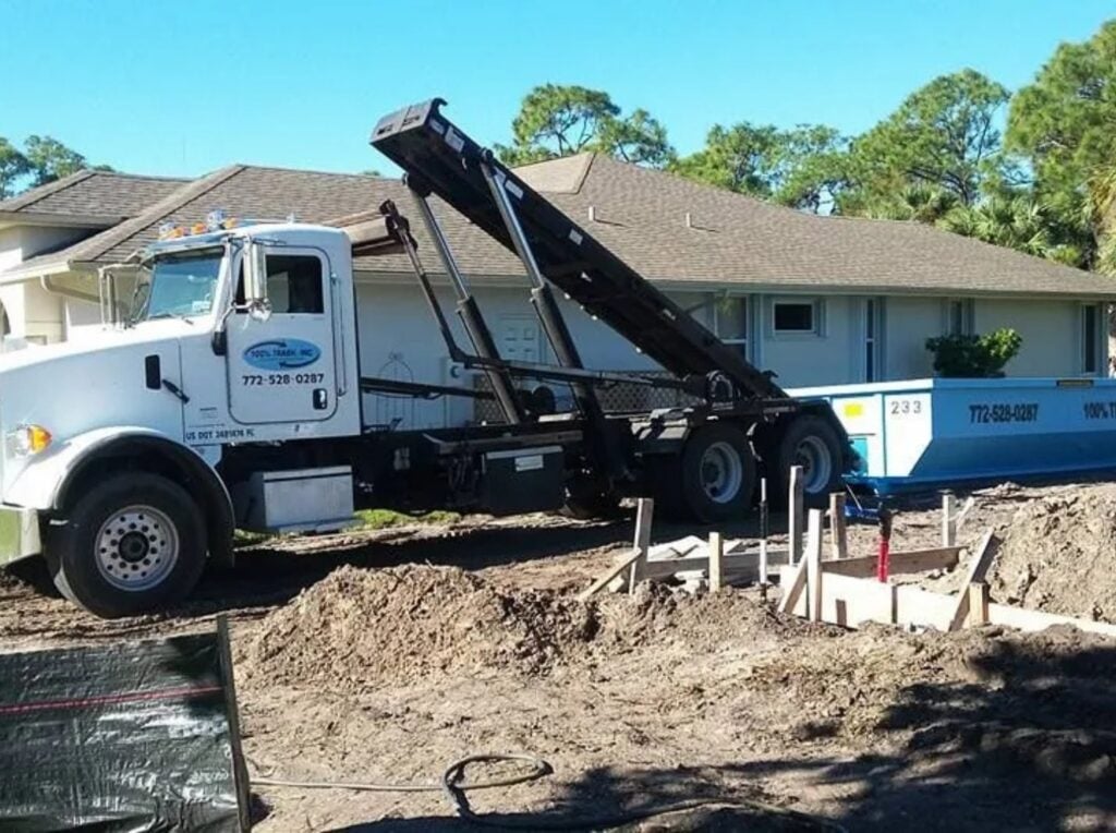 Construction truck near a residential home site.