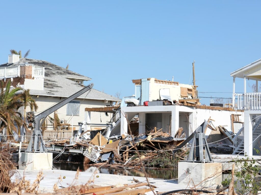 Hurricane damage to residential buildings and debris.
